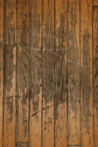 image of a damanged hardwood floor from wear and tear
