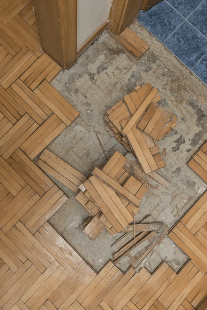 image of hardwood flooring broken off from flooring