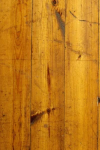 image of scratched hardwood floor on a lighter yellow floor