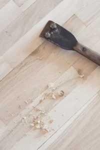 scraper sitting on hardwood floor
