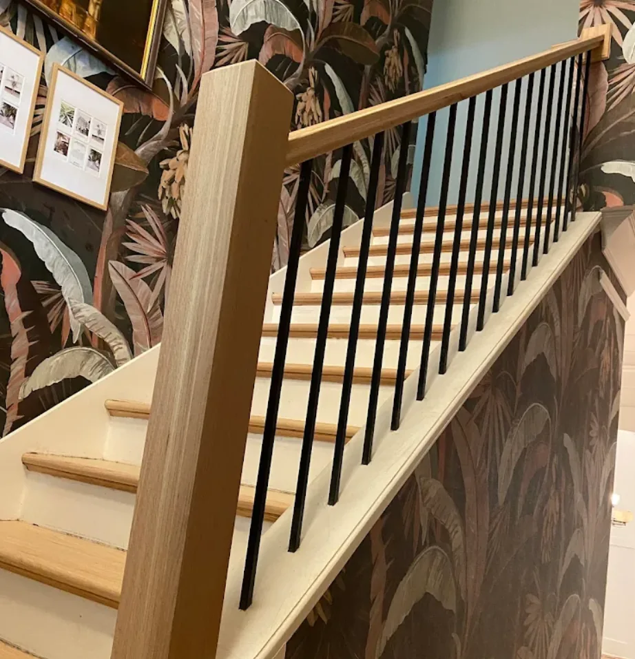 White oak hardwood stair installation with iron balusters in Brookhaven, GA