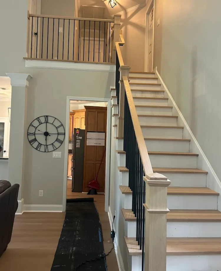 White oak hardwood stair installation in a two-story Kennesaw, GA foyer