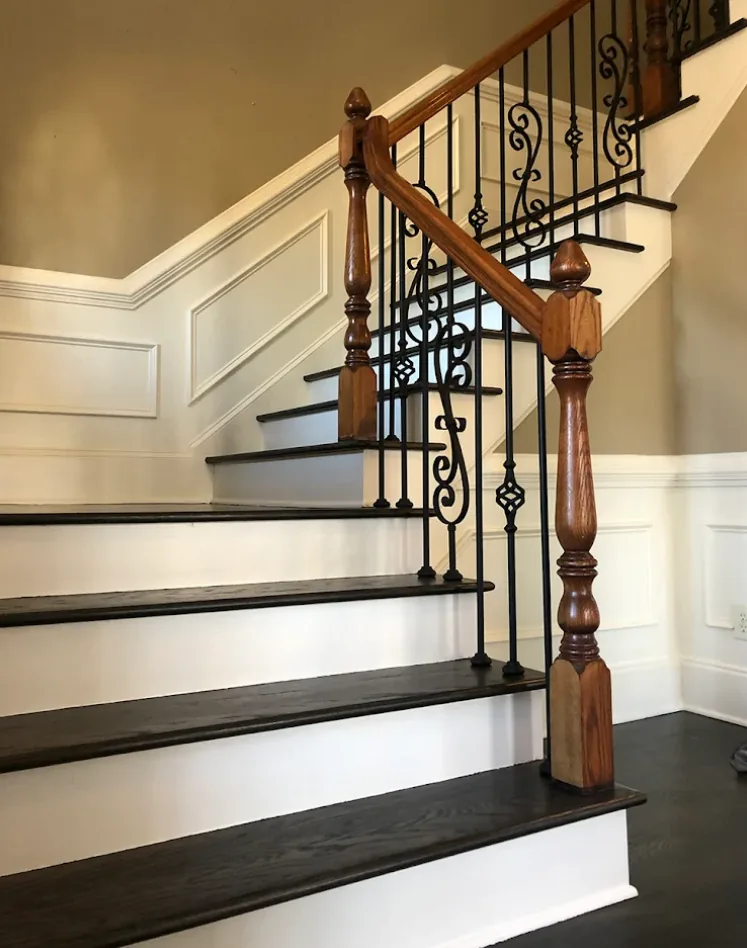 Refinished hardwood stairs with wrought iron balusters in Roswell, GA