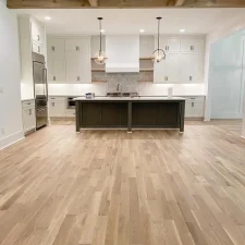 image of a modern kitchen with a large flooring area